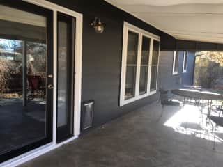 This is our covered patio, which you enter off the dining area. It's really pleasant to sit here and very private in the summer when all the greenery fills in. The Wifi extends here too.