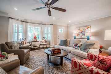 Comfortable living room with large TV above the fireplace.