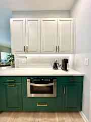 Nespresso coffeemaker, electric kettle and rollout microwave.