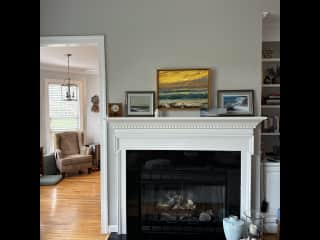 living area fireplace looking into the sitting area in the kitchen