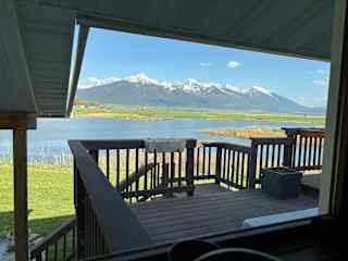 Deck, pond, and mountain view as seen from kitchen window.