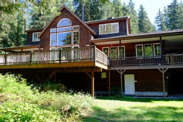 Exterior, including deck facing the river.