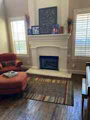 Front Living Area w/ fireplace, piano, and guitars.