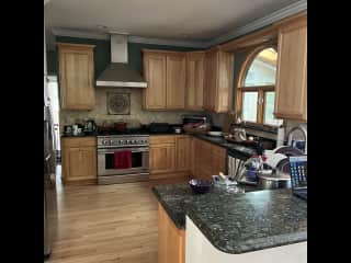 Galley kitchen well stocked.