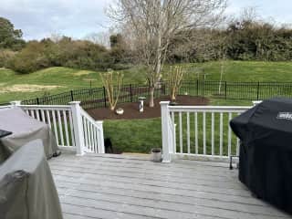 fenced backyard with deck