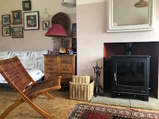 Wood burner, which can be lit on cooler evenings has a back burner which heats the water.