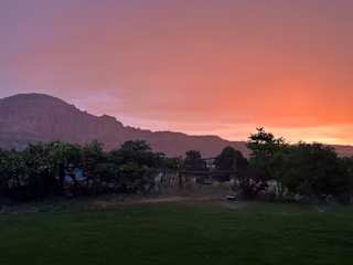 Sunrise from the porch with Torrey Knoll in the background.