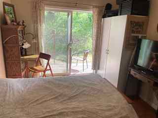 Bedroom #2
Has a private entrance with a nice deck to sit and read a book. Work place is a secretary desk. TV connects to a laptop via HDMI cable. 

This is the room we use as a guest room, TV room and office space.
