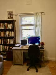 Full home office set up with desk and internet.