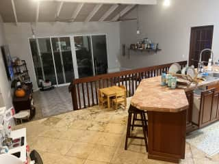 View into the kitchen & living room from the front door entryway.