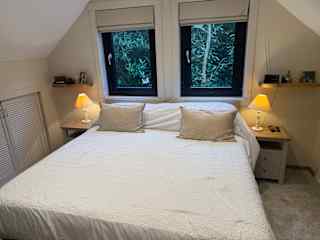 Air-conditioned bedroom with super kingsize bed.