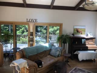 Living room area with sliding glass doors to deck