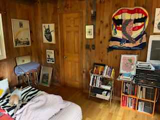 Bathroom entrance, books, art, old record player