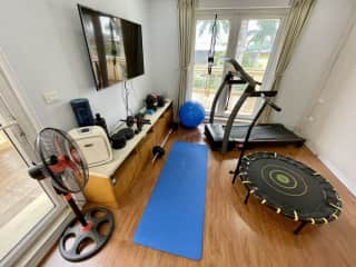 Exercise room - Third floor.  Air-conditioning, smart TV, treadmill, weights, yoga mat, yoga/stability ball, mini trampoline, weights and strength bands.