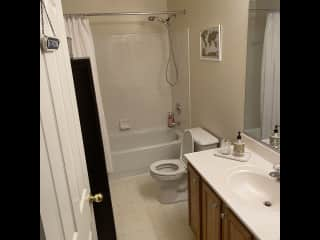 Guest bathroom with bath and shower for your stay. We can happily provide towels, loo roll and soap.