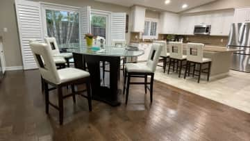 Spacious dining area with seamless flow into the gourmet kitchen, complete with new stainless steel appliances and fully-equipped with many gadgets you didn’t know you needed.