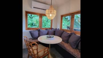 A banquette nook for indoor meals or an additional desktop