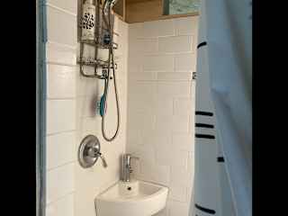 European style shower and toilet en suite bath.