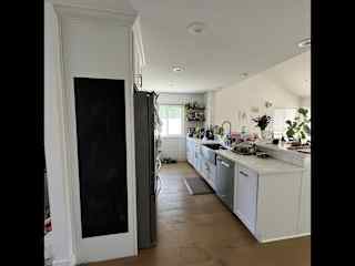 Kitchen and island bar with lots of natural light