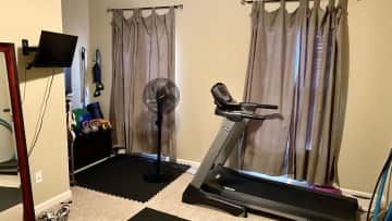 The bedroom converted into a makeshift gym. It's right beside the loft office upstairs.