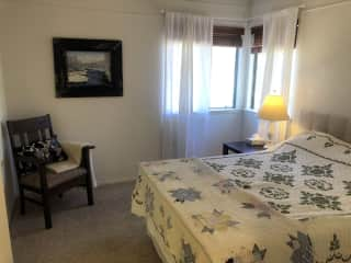 Upstairs guest room with double bed.