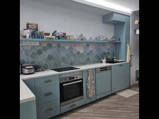 Kitchen area. We have an instant water filter/dispenser that serves from cold water to hot water. The washer and Steigen laundry rack (includes drying) is here as well.