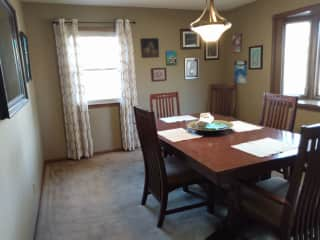 Formal dining room with bay windows overlooking the backyard.