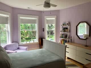 The lilac room - front bedroom with a queen sized bed.