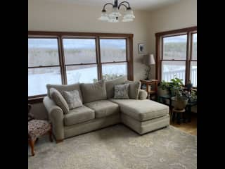TV room surrounded by windows