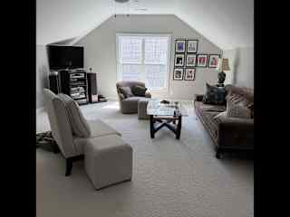 Upstairs family room. Comfy seating to watch tv upstairs. Also good old fashioned CD player with wonderful CD collection and ah-maz-ing speakers.