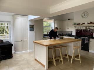 Garry in the kitchen. Tilly's crate on the left.