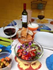 Enjoying home made salad with wine