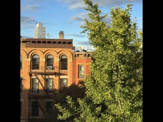 Bedroom view onto Prospect Place. It’s quite quiet.  New insulated windows keep the room cozy.