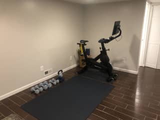 Home gym with large yoga mat