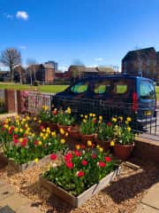 There is always something growing in the front garden from spring to autumn. That’s our van, which we normally park on our driveway. We’ve parked it there to show where your vehicle can go, right in front of the house if you like.  Street parking is free.