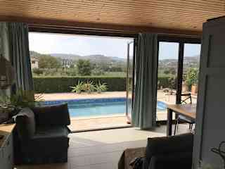 Looking from inside conservatory across pool