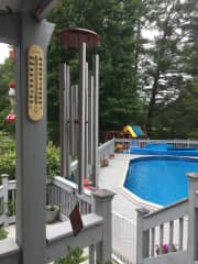 View of pool from covered deck area