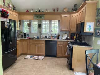 Kitchen with dishwasher, gas stove, and microwave.