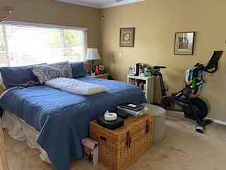 Master bedroom with Peloton bike.