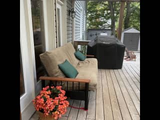 Another view of the outside sitting area and gas BBQ ready for backyard grilling.