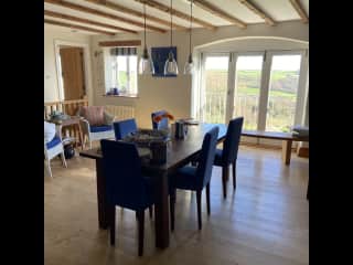 The dining area which is a throughway to the kitchen.