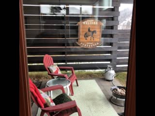 Sheltered outdoor room with firepit