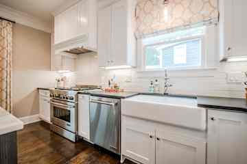 Modern kitchen with everything you need, including gas range, air fryer and Nespresso coffee machine.