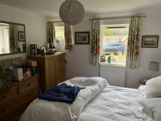guest bedroom. empty tallboy and chest of drawers