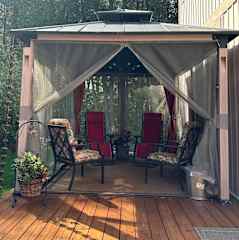 Screened in tent with zero gravity chairs to relax—read , enjoy a glass of wine