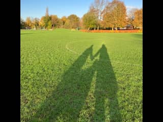 Walking our dog in the park, just before sunset