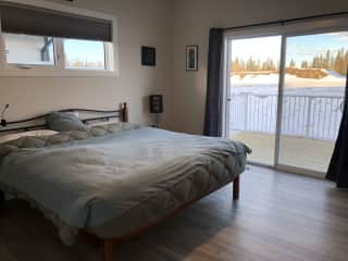 Master bedroom with access to deck.