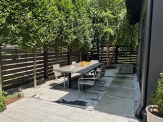 The beer garden (updated with turf since this photo was taken) includes a ping pong table and string lights.