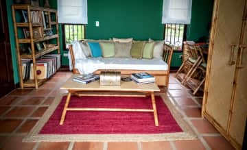 Looking into Guest Bedroom / Office  from Guest Bedroom Terrace. Popup Trundle Converts Daybed to King Size Bed.  The trundle can also be set up as a separate bed.  All Bamboo Furniture Created by Local Artisan