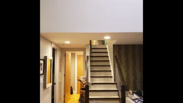 Stairs up to second floor and hallway leading to master bedroom.